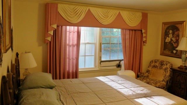 5705 Orly Terrace Atlanta, GA 30349 - Photo 38 of 42 a bedroom with a bed and a window