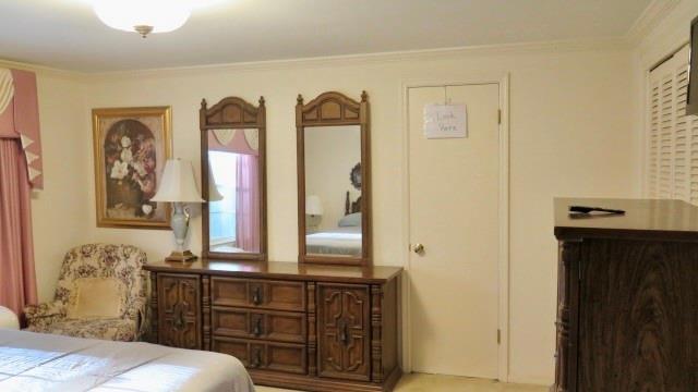 5705 Orly Terrace Atlanta, GA 30349 - Photo 39 of 42 a bedroom with a bed and a dresser