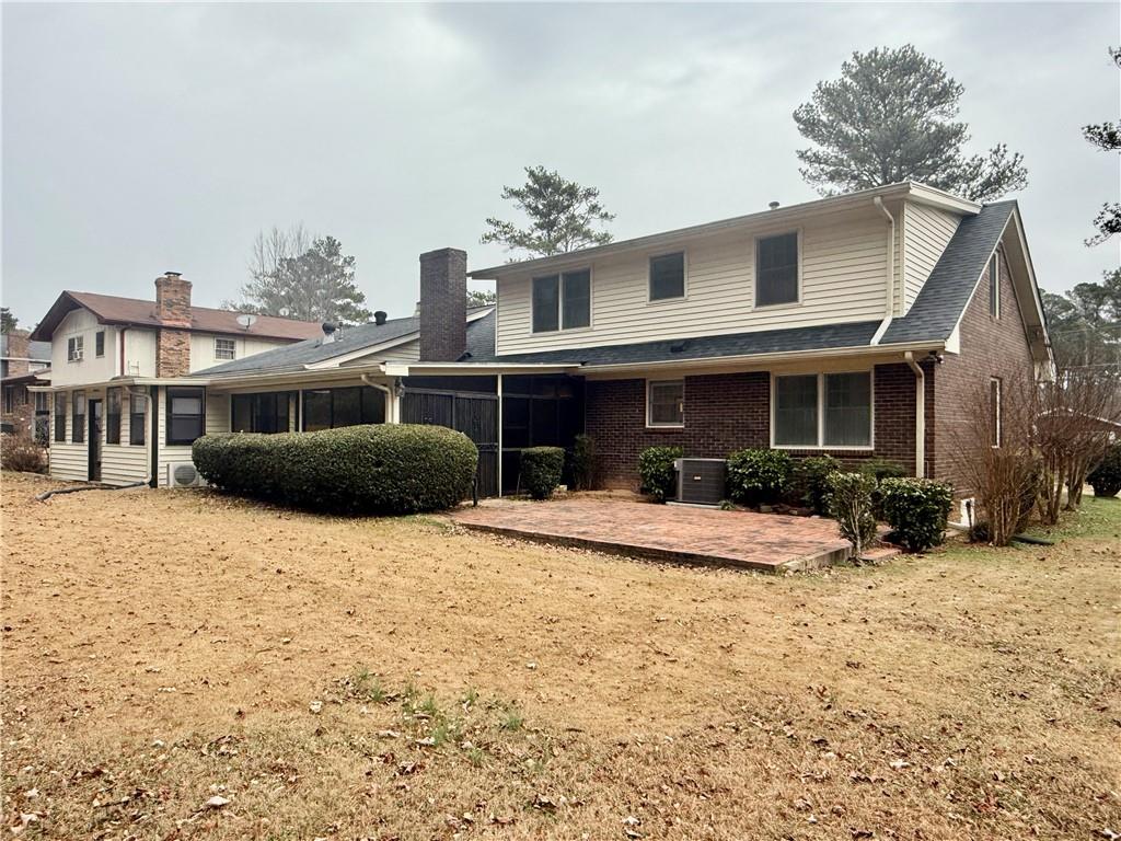 5705 Orly Terrace Atlanta, GA 30349 - Photo 41 of 42 a front view of a house with a yard
