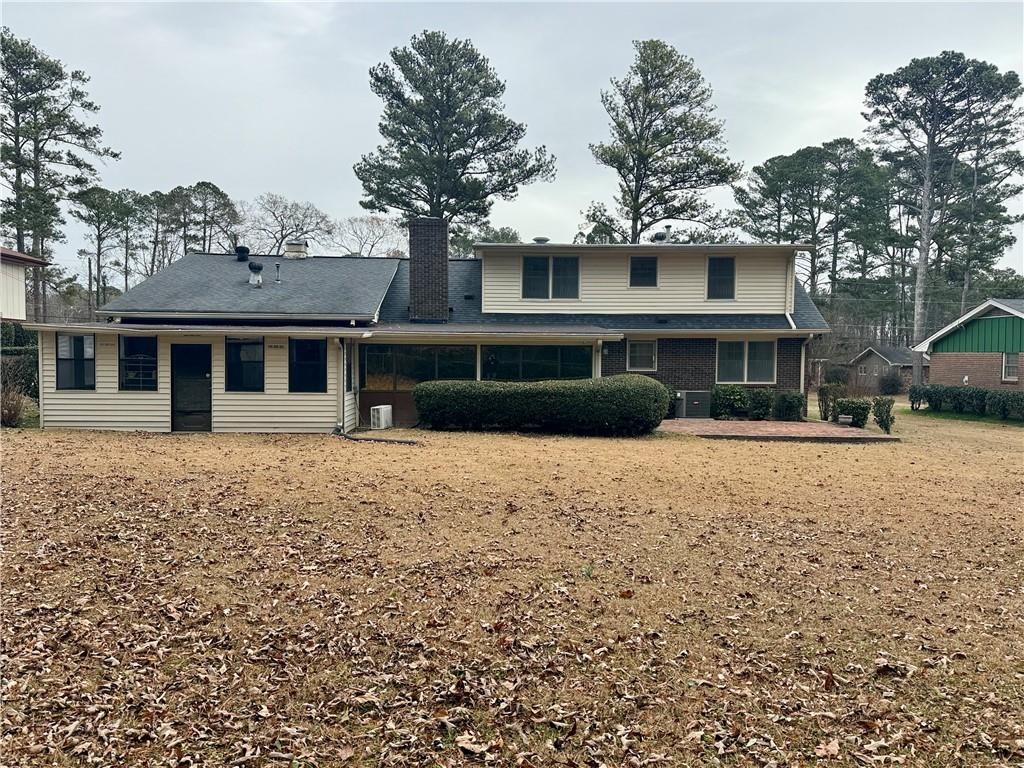 5705 Orly Terrace Atlanta, GA 30349 - Photo 42 of 42 a front view of a house with a yard