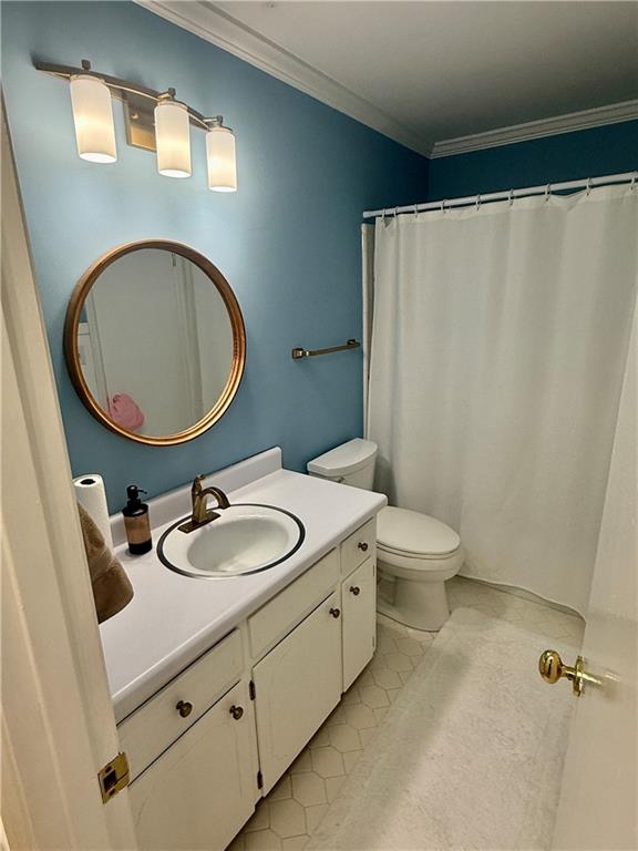 5705 Orly Terrace Atlanta, GA 30349 - Photo 6 of 42 a bathroom with a sink a toilet and a mirror