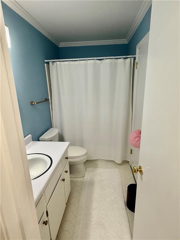 5705 Orly Terrace Atlanta, GA 30349 - Photo 7 of 42 a bathroom with a granite countertop sink toilet and shower