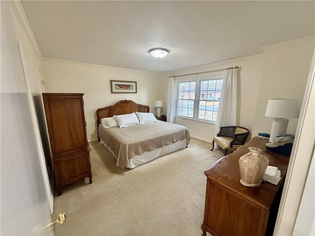 5705 Orly Terrace Atlanta, GA 30349 - Photo 9 of 42 a bedroom with furniture and a window