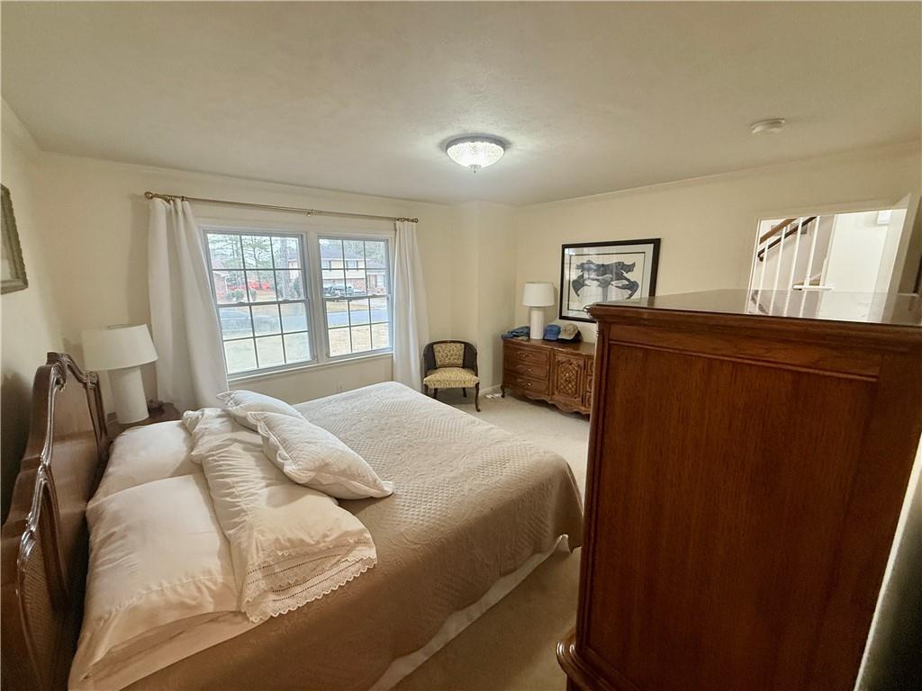 5705 Orly Terrace Atlanta, GA 30349 - Photo 10 of 42 a bedroom with a bed and window