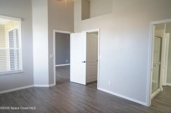 a view of an empty walk in closet with empty racks