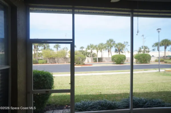 a view of a small space with wooden floor