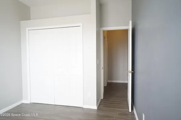 a bathroom with a sink a toilet and a window