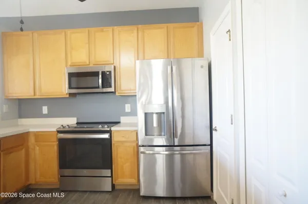 a stove top oven sitting inside of a kitchen