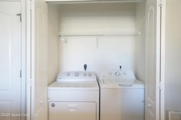 a view of a living room with wooden floor