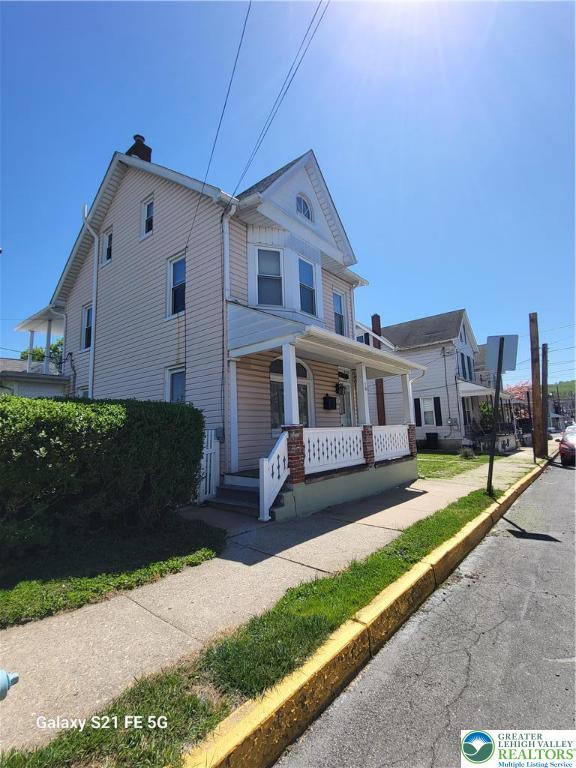 37 6th Street Emmaus, PA 18049 - Photo 31 of 31 a view of a white house with a big yard and potted plants