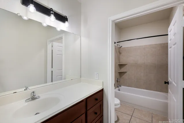 a bathroom with a toilet and a bathtub