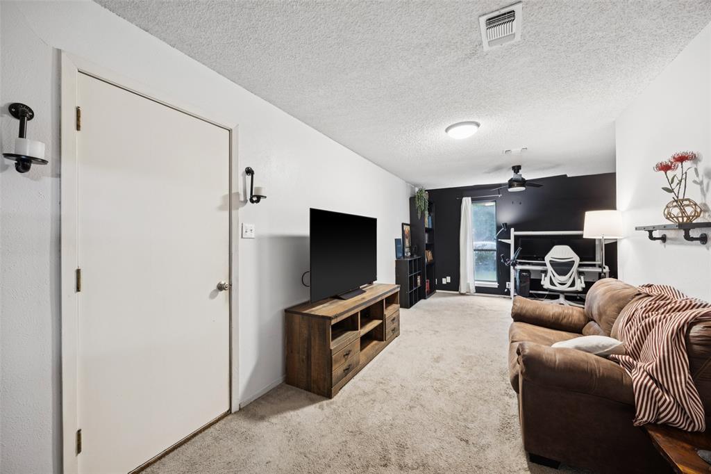 3569 Luella Road Sherman, TX 75090 - Photo 11 of 38 a living room with furniture and a flat screen tv