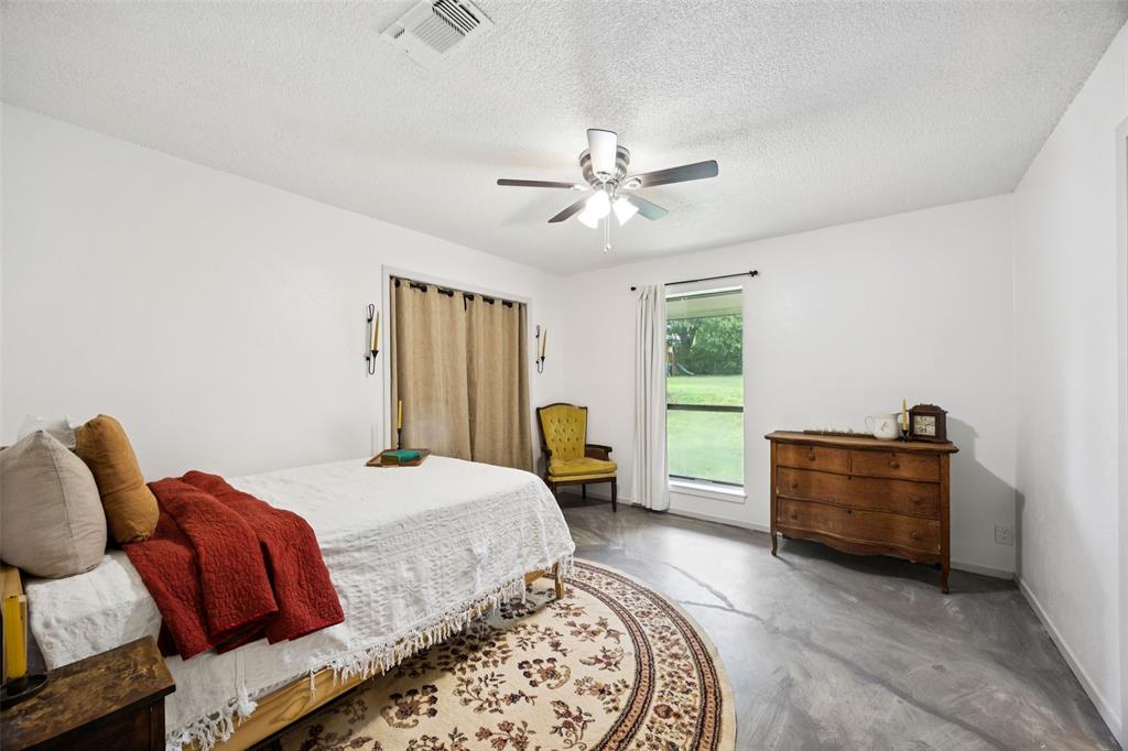 3569 Luella Road Sherman, TX 75090 - Photo 18 of 38 a bed room with a bed and a window