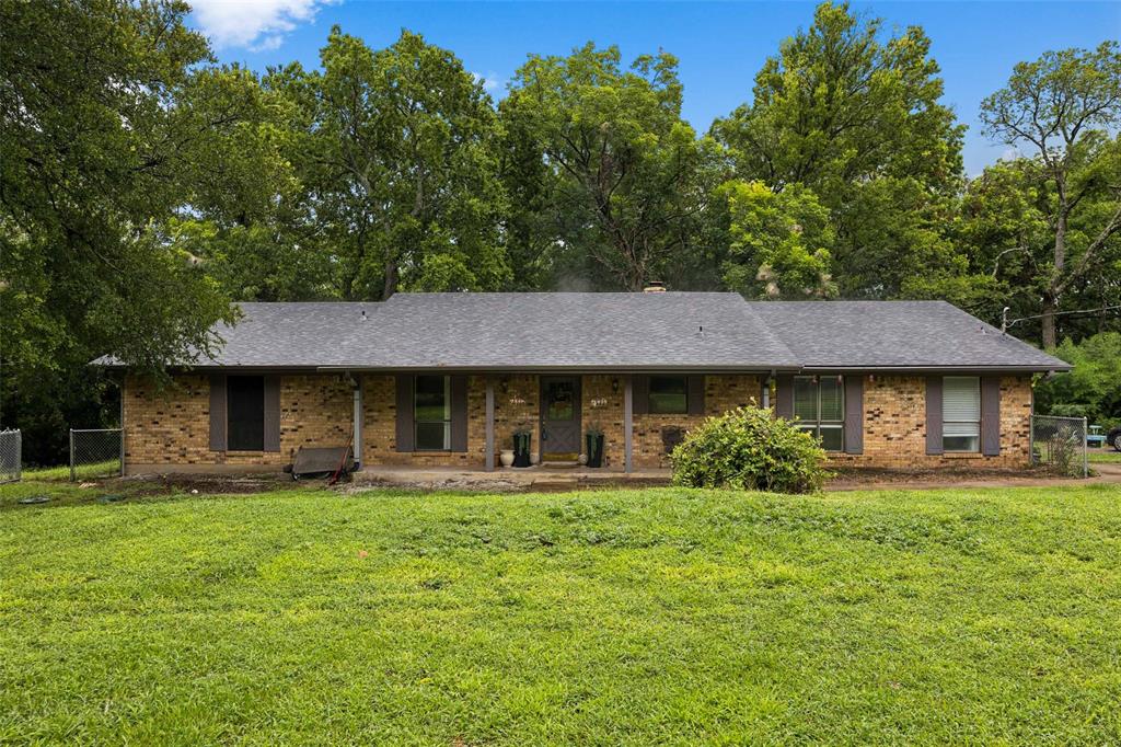 3569 Luella Road Sherman, TX 75090 - Photo 2 of 38 a front view of a house with garden