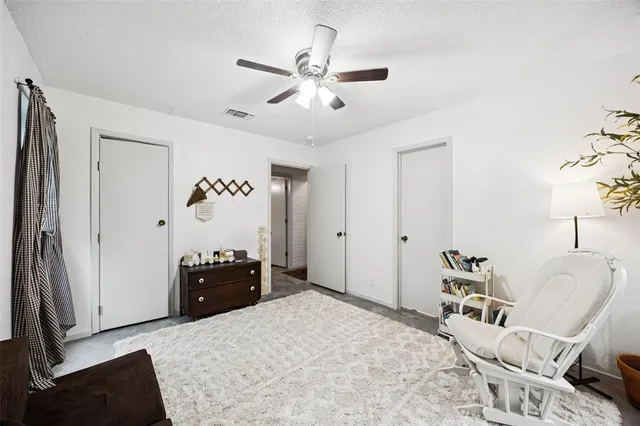 a bedroom with a bed and furniture