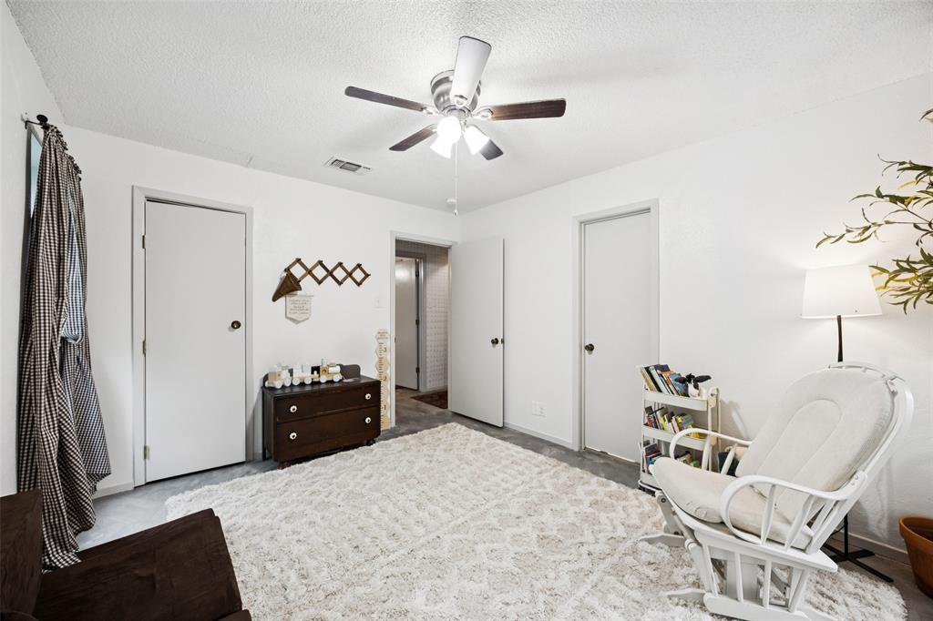 3569 Luella Road Sherman, TX 75090 - Photo 21 of 38 a bedroom with a bed and furniture