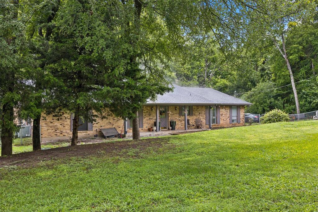 3569 Luella Road Sherman, TX 75090 - Photo 29 of 38 a view of a house with a yard
