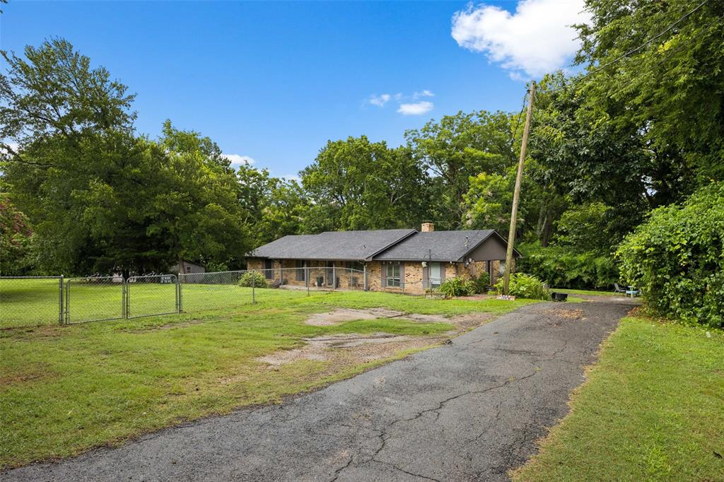 3569 Luella Road Sherman, TX 75090 - Photo 31 of 38 a view of lawn chairs and a big yard