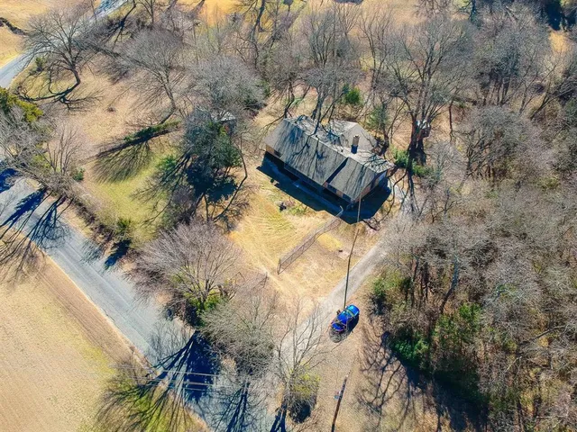 a view of a yard with trees