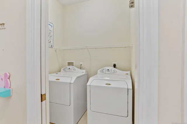 a utility room with dryer and washer
