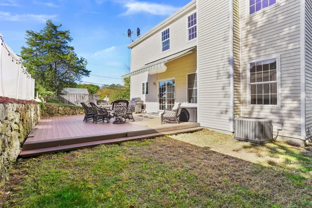a view of a backyard with sitting area