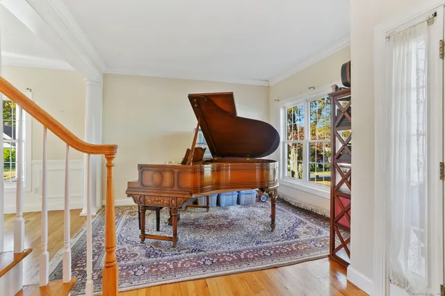 a living room with furniture and a rug