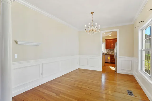 a view of livingroom with kitchen and window