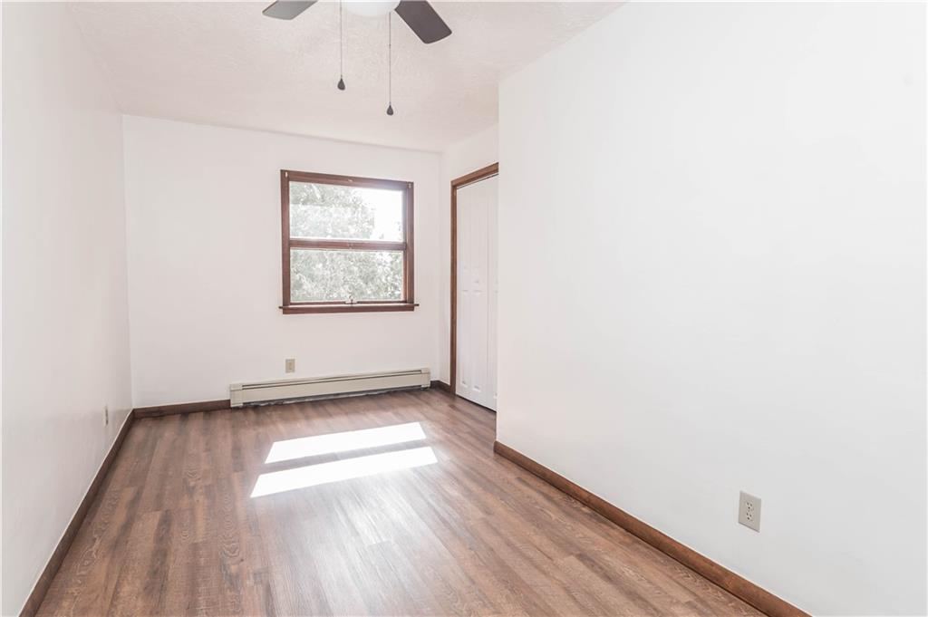 12 Bush Road Home, PA 15747 - Photo 14 of 22 an empty room with wooden floor and windows