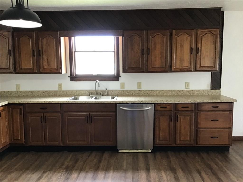 12 Bush Road Home, PA 15747 - Photo 8 of 22 a kitchen with granite countertop a sink cabinets and wooden floor