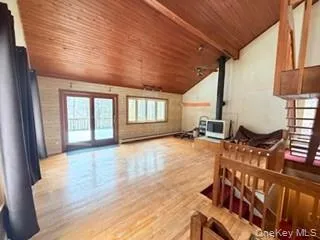 a view of an entryway with wooden floor