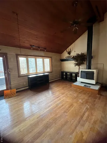 a living room with furniture fireplace and flat screen tv