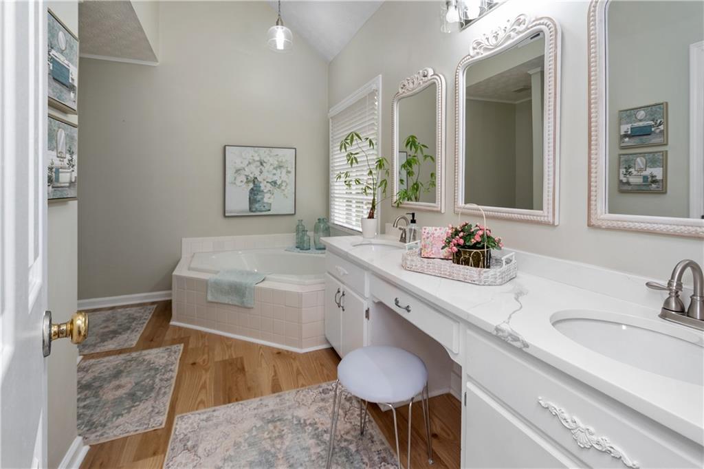 405 Ridgemont Drive Fayetteville, GA 30215 - Photo 20 of 43 a bathroom with a granite countertop sink and a mirror