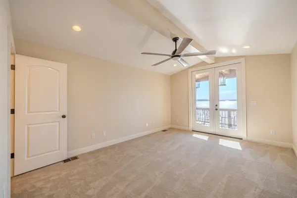 a view of an empty room with a window