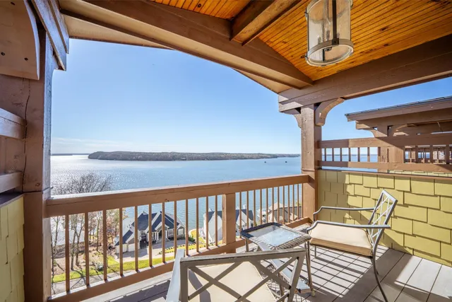 a view of a chairs and table in the balcony