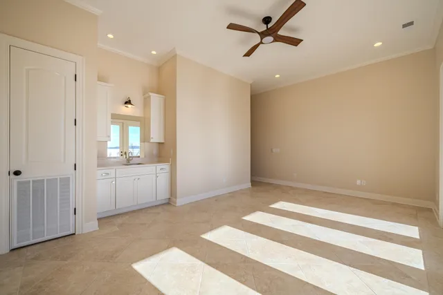 a bathroom with a tub shower vanity and a sink