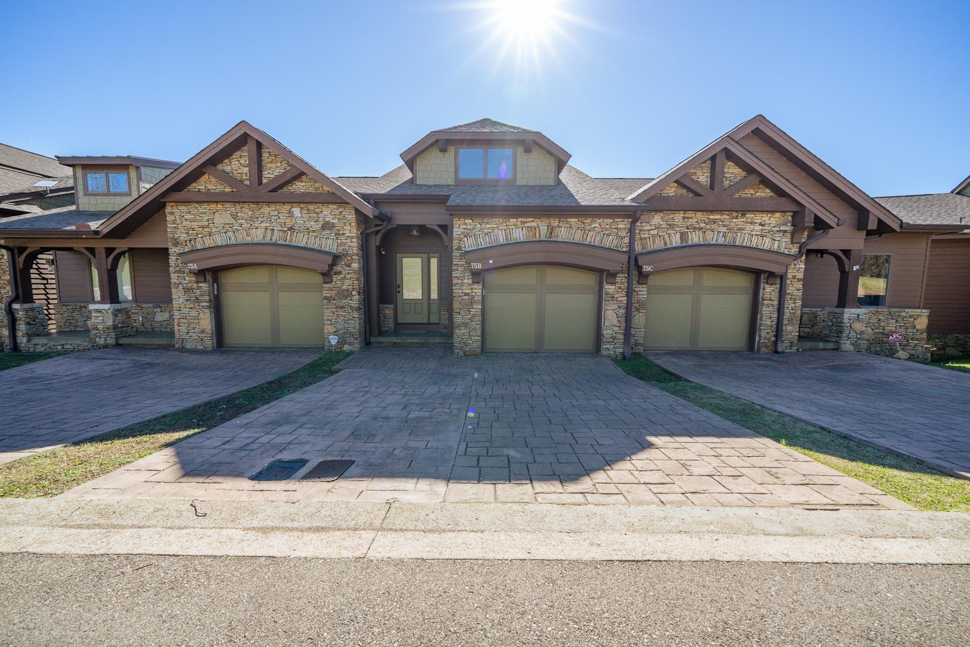 0 Oasis Lane Savannah, TN 38372 - Photo 3 of 31 a front view of a house with a yard and garage