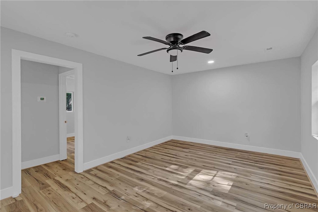 830 Glebe Road Mathews, VA 23109 - Photo 2 of 17 a view of a big room with wooden floor closet and windows