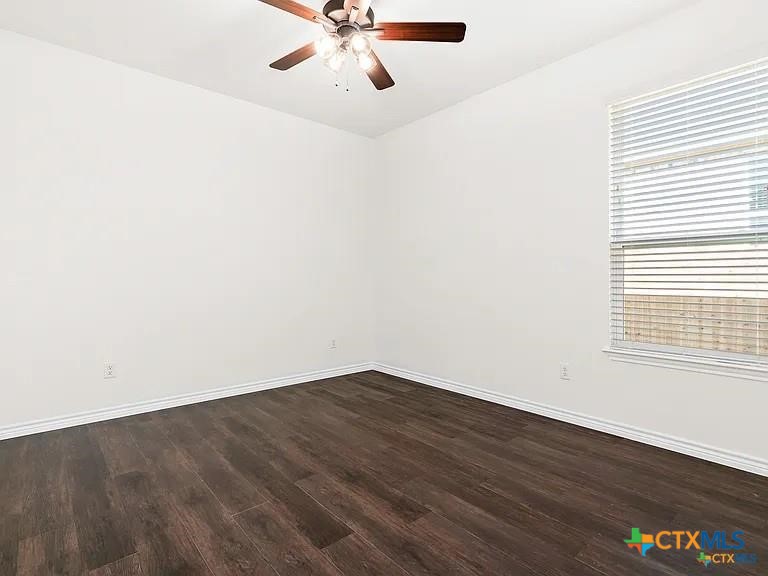 5104 Rose Gdn Loop Killeen, TX 76542 - Photo 12 of 29 a view of an empty room with wooden floor and a window