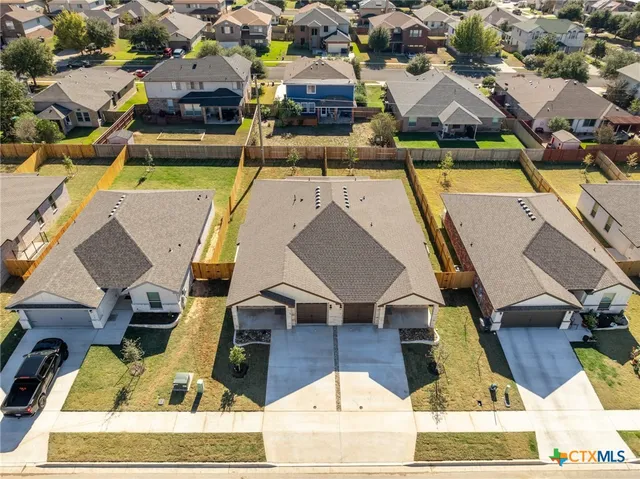 an aerial view of a house with swimming pool