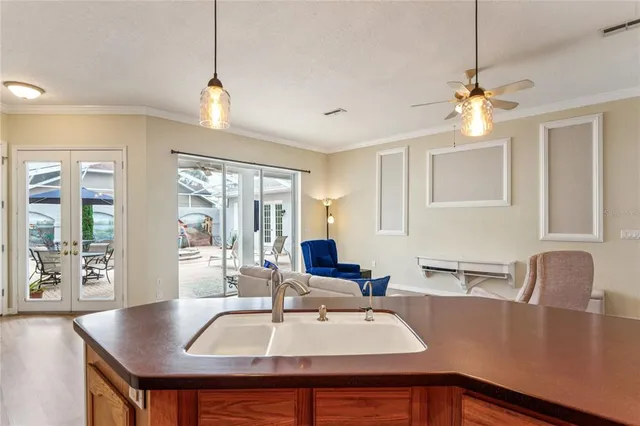 a kitchen with stainless steel appliances granite countertop a refrigerator a sink and a stove