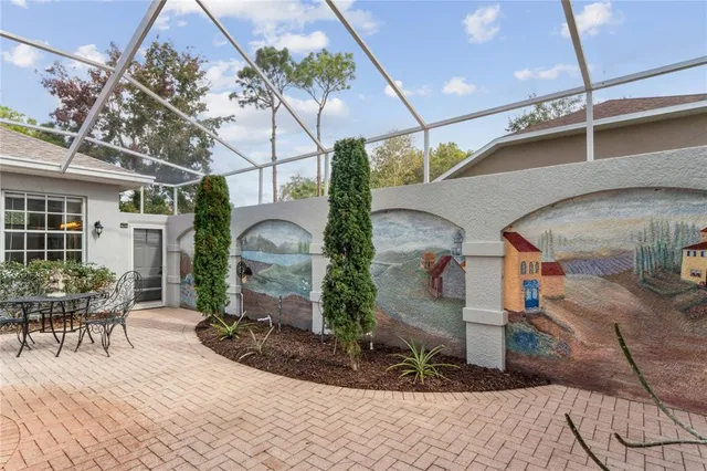 a view of a patio with table and chairs and potted plants