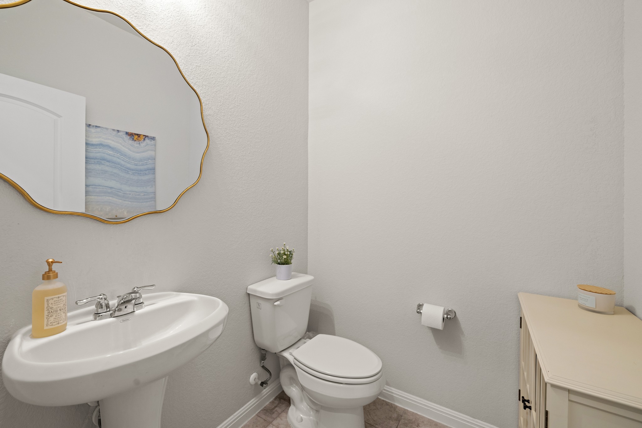 2049 Winston Way Leander, TX 78641 - Photo 22 of 35 Powder bath on lower level is convenient for guests.