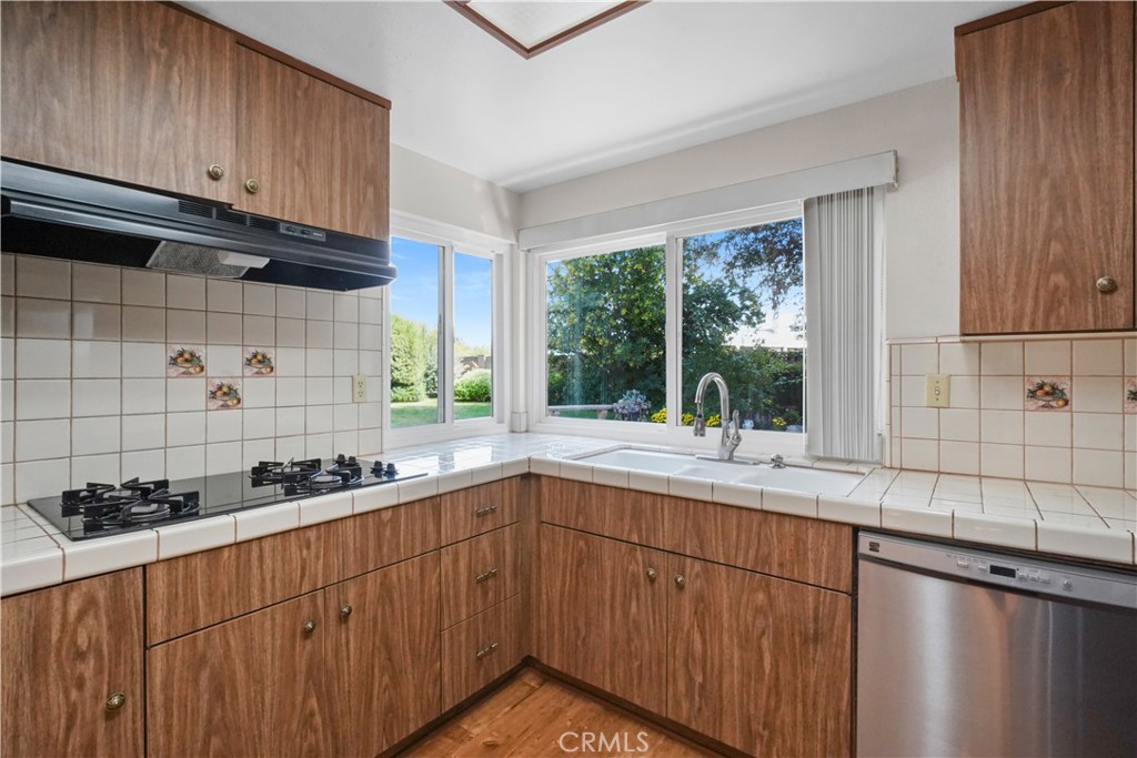 3136 Voltaire Drive Topanga, CA 90290 - Photo 15 of 48 a kitchen with a sink and cabinets
