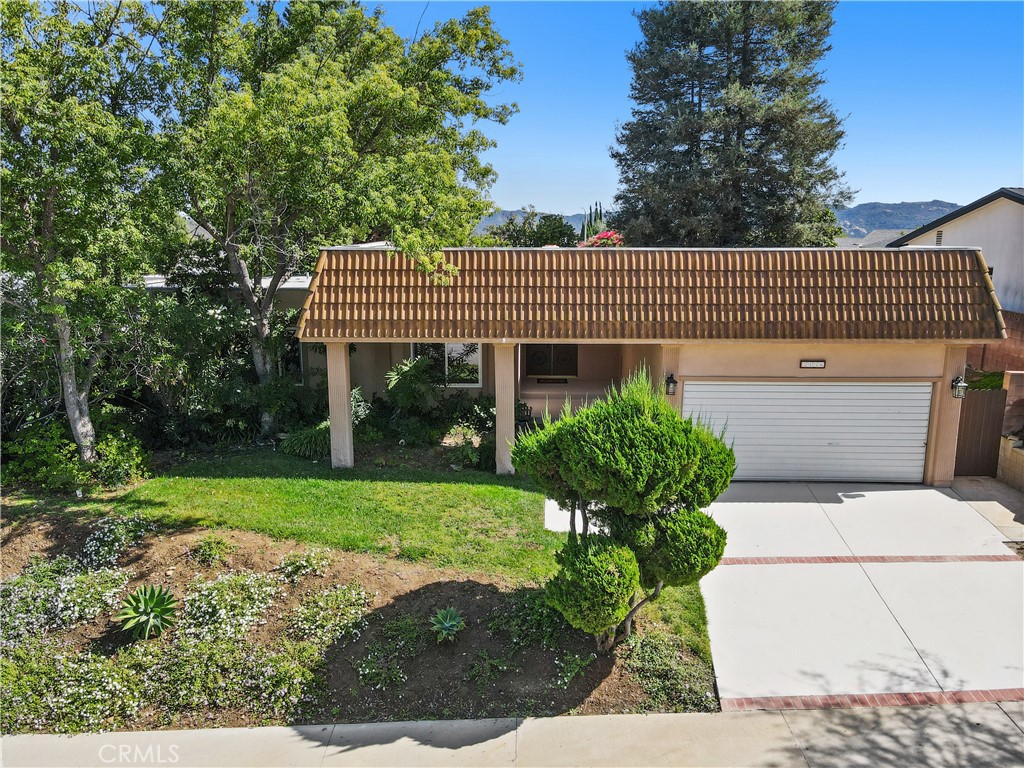 3136 Voltaire Drive Topanga, CA 90290 - Photo 2 of 48 a front view of a house with garden
