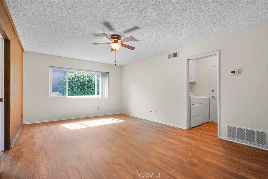 3136 Voltaire Drive Topanga, CA 90290 - Photo 21 of 48 a view of an empty room with a window and wooden floor