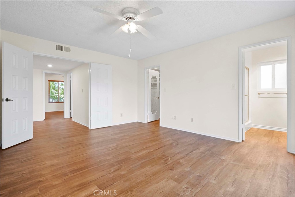 3136 Voltaire Drive Topanga, CA 90290 - Photo 26 of 48 an empty room with wooden floor and ceiling fan