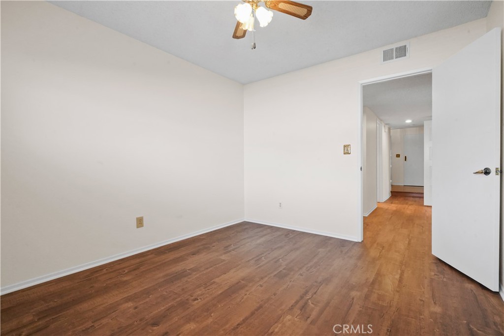 3136 Voltaire Drive Topanga, CA 90290 - Photo 36 of 48 a view of a room with wooden floor a chandelier fan and a window
