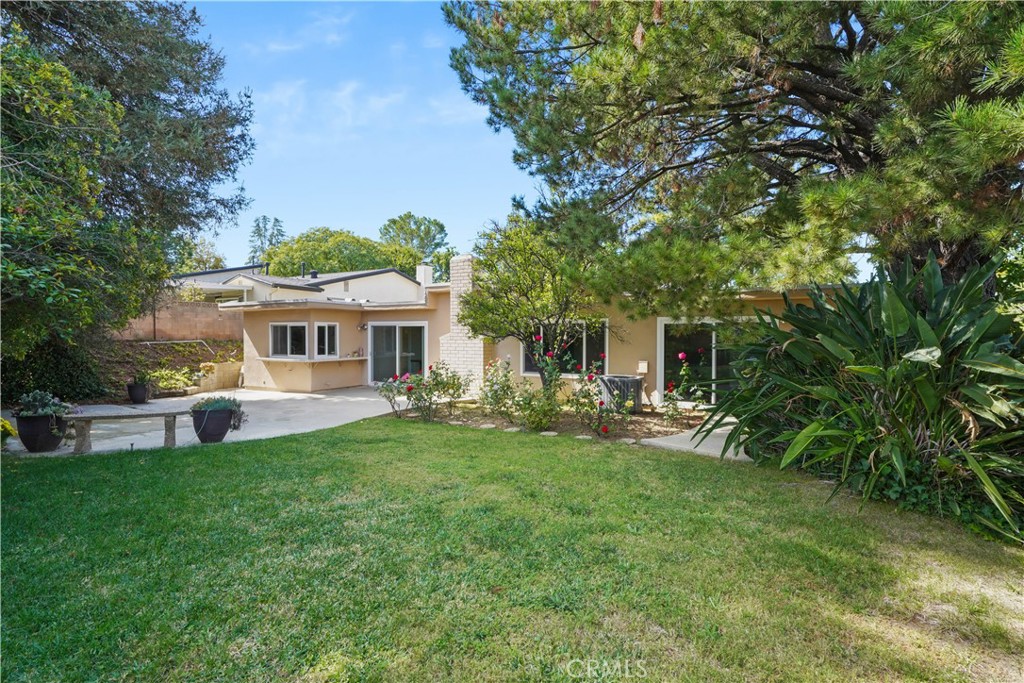 3136 Voltaire Drive Topanga, CA 90290 - Photo 40 of 48 a front view of a house with a garden and trees