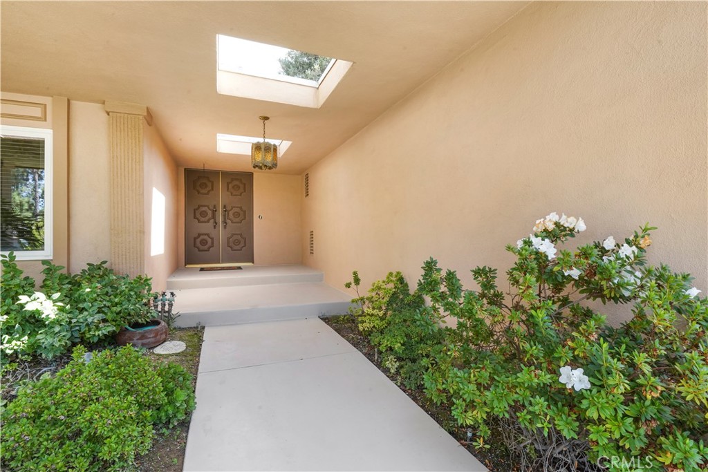 3136 Voltaire Drive Topanga, CA 90290 - Photo 4 of 48 a front view of a house with a yard