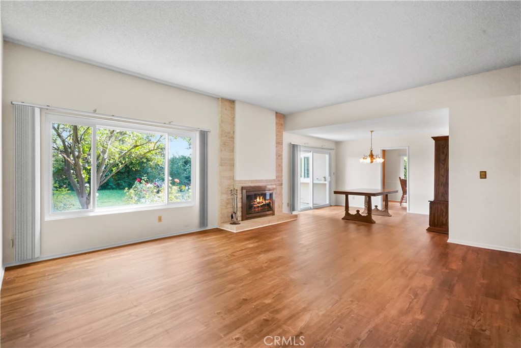 3136 Voltaire Drive Topanga, CA 90290 - Photo 5 of 48 a view of empty room with fireplace and wooden floor